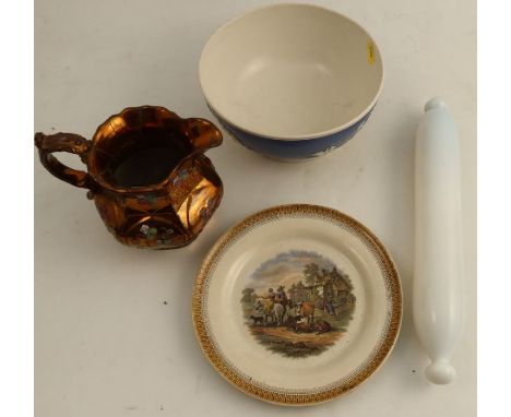 A 19th century pottery bowl, with applied Classical decoration to a blue ground diameter 8ins, together with a lustre ware ju