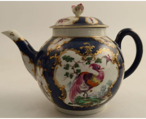 An 18th century Worcester bullet shaped teapot, the scale blue ground decorated with reserve panels of insects and fabulous b