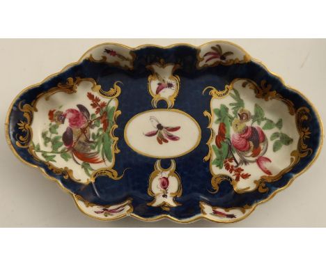 An 18th century Worcester spoon tray, of shaped oval form, the scale blue ground decorated with reserve panels with insects a