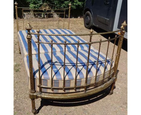 R W Winfield &amp; Co, London&nbsp;and Birmingham, a gilt metal bed, with curved end, 79ins x 49ins
