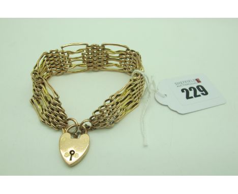 A Fancy Link Gate Style Bracelet, to heart shape padlock style clasp (stamped "9ct" (damage/incorrect repair). 