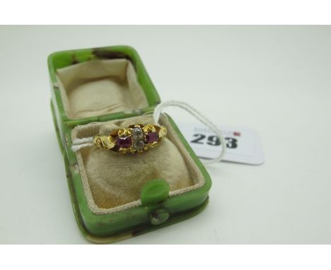 An Antique Ruby and Diamond Four Stone Ring, old cut stones within scroll setting, stamped "18ct" (finger size N) (3.6grams),