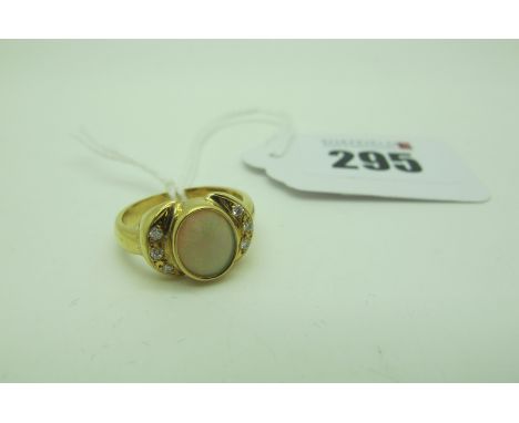 A Modern Opal and Diamond Ring, oval cabochon collet set to the centre, between inset shoulders, stamped "18k" (finger size  