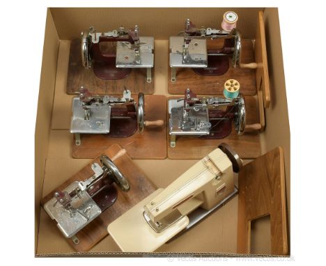 Essex (UK) collection of five miniature children's vintage Sewing Machines, maroon cast iron, crank handle driven; plus a Vul