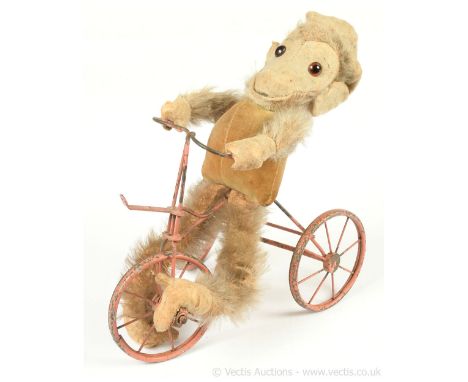 Chad Valley Tango vintage monkey on a tricycle, British, 1930s, red embroidered label to sole of left foot, amber and black g