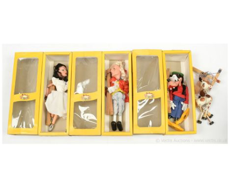 Pelham Puppets four vintage marionettes: (1) Walt Disney Goofy, within yellow window box; (2) Prince Charming, within yellow 
