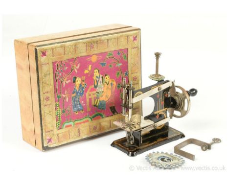 Casige (Germany) miniature antique Sewing Machine, 1920s, impressed with eagle logo, tinplate, crank handle, chain stitch, so