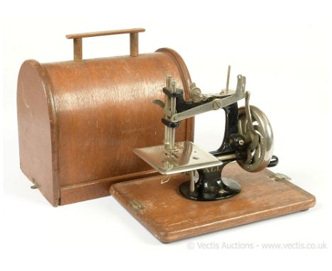 All Lead (Japan) Mk 1 miniature vintage Sewing Machine, 1933-1941, with bentwood carry case, cast iron and tinplate, crank ha
