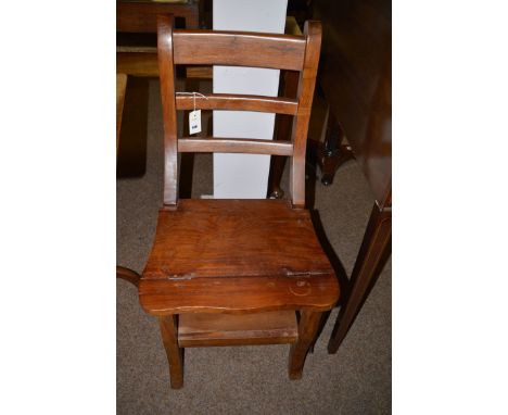 A stained wood metamorphic library chair, the solid seat hinged and folding to form step ladder.