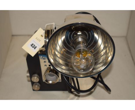 A reproduction vintage style camera design table lamp.