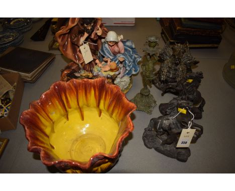 A pair of spelter 'Marley Henses' a spelter candlestick; together with a ceramic group depicting a nativity scene; a ceramic 