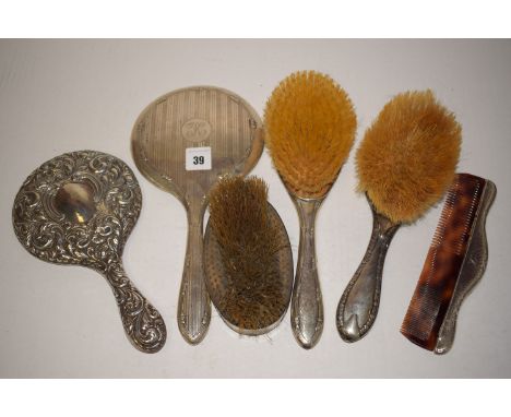 Silver backed dressing table hand mirrors; brushes; comb; etc.