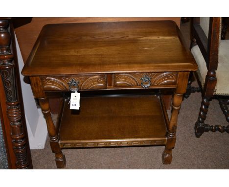 A dark stained Ercol side table fitted two frieze drawers raised on turned legs joined by undertier, 26in. wide.