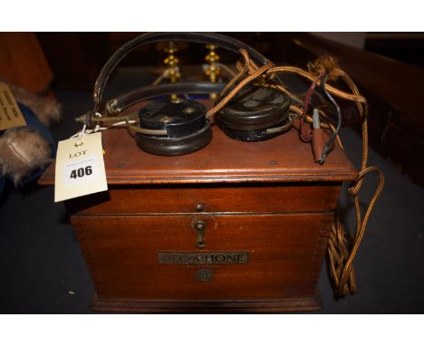 A vintage Gecophone BBC wireless with headphones, instrument no. 1252 (missing its loading coil).