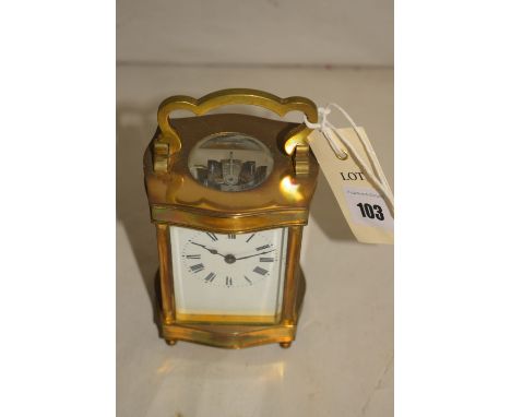 A brass cased carriage clock, the white enamel roman dial enclosed by bevelled glass panels.