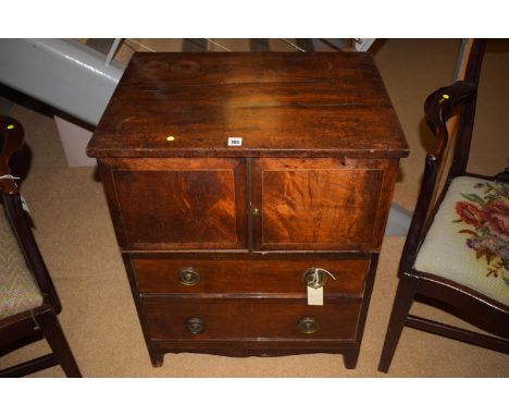 A Georgian mahogany commode, converted, fitted a pair of doors above two drawers, 23 1/2in. wide.