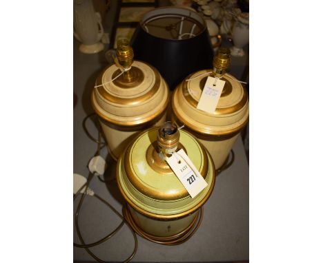 An American brass standard lamp with black shade; together with three painted table lamps by Laura Ashley; and three shades.