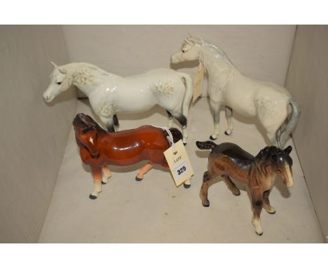 A pair of Beswick figures of dapple-grey ponies; a Beswick foal; and another ceramic horse.  (4)