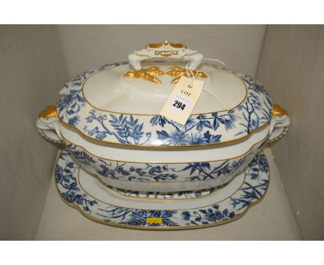 A late 19th Century Royal Worcester blue and white transfer decorated oval tureen cover and stand, with elephant handles.