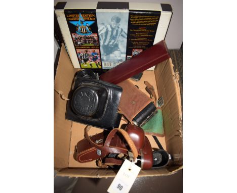 A Zenit-e 35mm SLR camera with leather case; a Comet 5 camera in leather case; folding pocket camera; three modern cigarette 