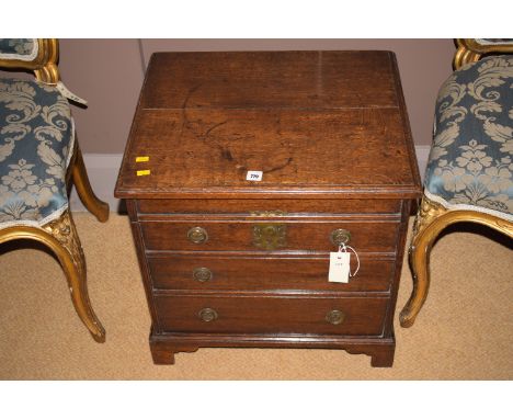 A 19th Century oak commode with false front, 20in. wide.