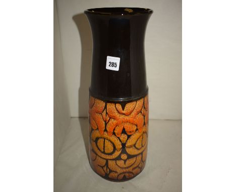 A large modern Poole ceramic vase with tapering body and flared rim, the top in black glaze and the lower part with stylized 