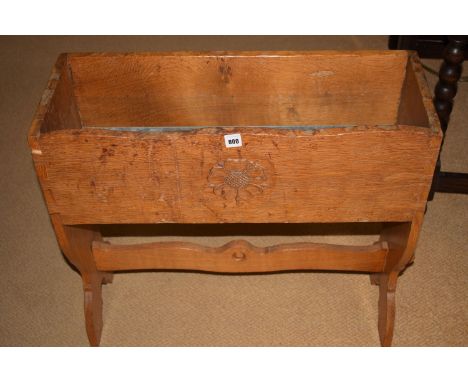 Possibly Peter "Rabbitman" Heap: a carved oak planter, with rose head and adzed design, carved motif to one leg, 25 x 9 1/2 x