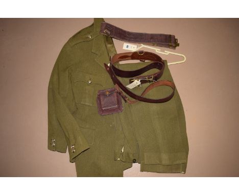British Army officers military uniform, by John Jones & Co., comprising: tunic and trousers, canvas belt, a leather Sam Brown