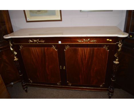 A French style commode, the stone top above caryatid mounted supports, flanked by a pair of mahogany panel doors, raised on t