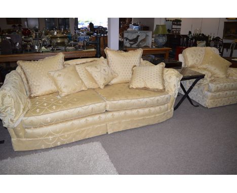 A sofa, possibly from Gascoigne, decorated in yellow coloured fleur-de-lys and swag design, fitted loose seat cushions and sc