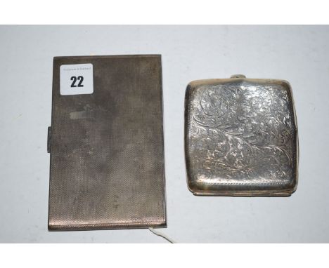 An Art Deco silver cigarette case of engine turned design; together with another cigarette case.