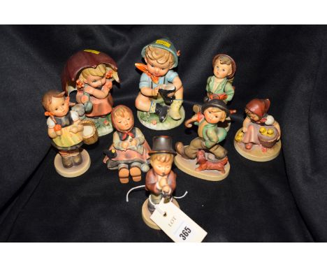 A collection of six Hummel figures of children, various; and two similar ornaments.  (8)