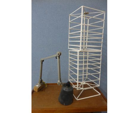 An anglepoise lamp and shop display stand 