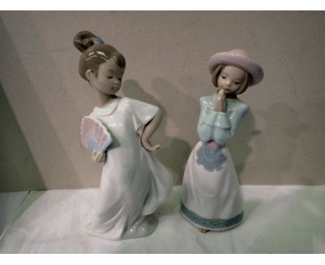 Two Nao figurines, one with head reglued, both boxed. Not available for in-house P&amp;P 