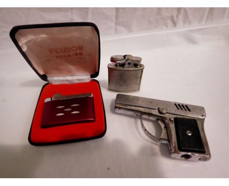 Three lighters including Ronson Cadet and a novelty example. UK P&amp;P Group 1 (£16+VAT for the first lot and £2+VAT for sub