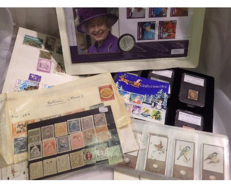 Quantity of mixed stamps including six capsuled stamps and a complete set of 50 Godfrey Phillips cigarette cards. UK P&amp;P 