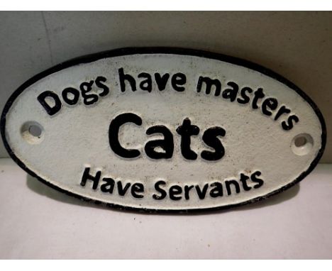 Cast iron dogs have masters cats have servants, W: 20 cm. UK P&amp;P Group 1 (£16+VAT for the first lot and £2+VAT for subseq