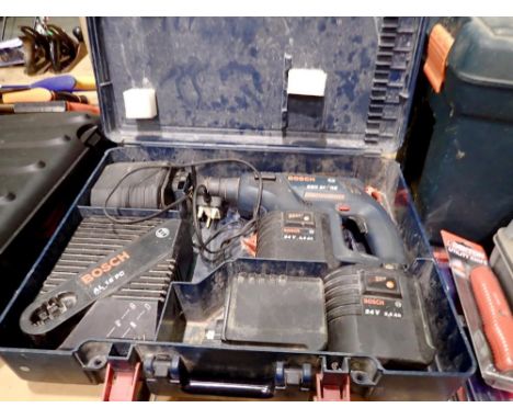 Bosch hammer drill with four batteries and charger. All electrical items in this lot have been PAT tested for safety and have