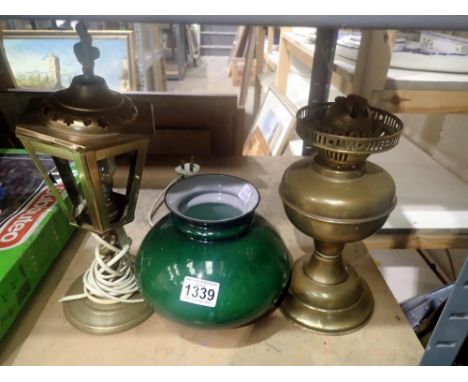 Brass oil lamp with green glass shade and an electric example. Not available for in-house P&amp;P 