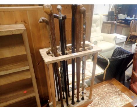 Wooden stick stand with ten walking sticks. Not available for in-house P&amp;P 