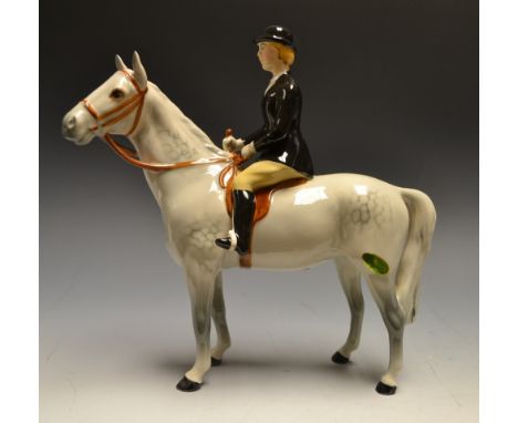 A Beswick model huntswoman on grey horse, black jacket, printed marks, labelled. 