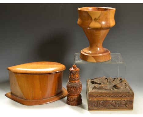Treen - a carved Coquilla nut pepperette or needle case; an olive wood candlestick; a carved wooden box etc  (4)