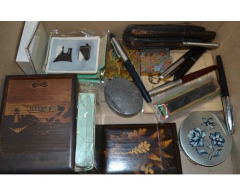A silver Victorian jubilee brooch; cigarette cards; fountain pens; miniature magic lantern slides; powder compacts; marquetry