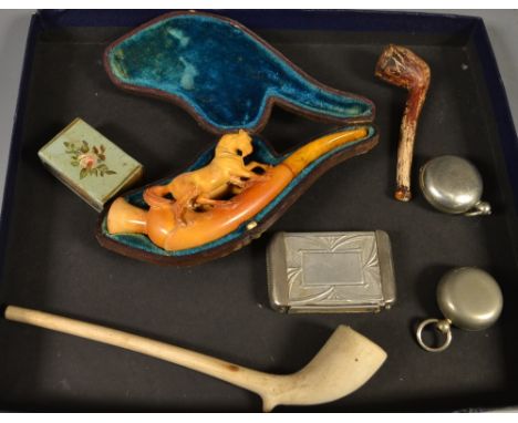 Tobaccania  - A meerschaum pipe, as a pair of horses, amber coloured mount piece, cased;  a clay pipe; a vesta case;  a silve
