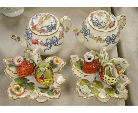 A pair of Victorian semi-porcelain preserve stands, modelled as strawberries on a leaf, loop handles; a pair of Worcester glo
