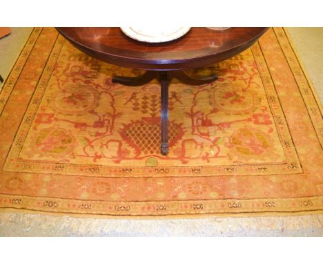 A large 19th century Northern Pakistan silk carpet, woven in the traditional manner with stylized floral motifs, tassel borde