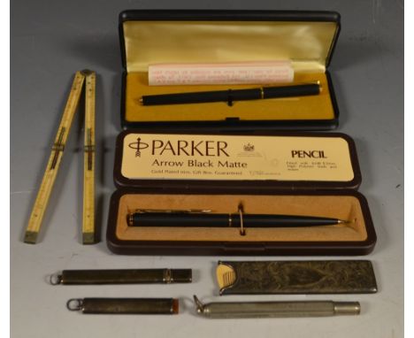 Pens and Pencils - a silver cased flat retangular pencil; a bone folding 12 inch rule; a Parker arrow blank matte propelling 