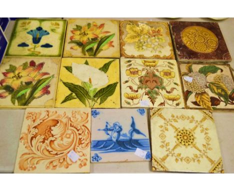 Tiles - a 19th century Delft tile painted with a merman firing an arrow ; other majolica tile; etc (11)
