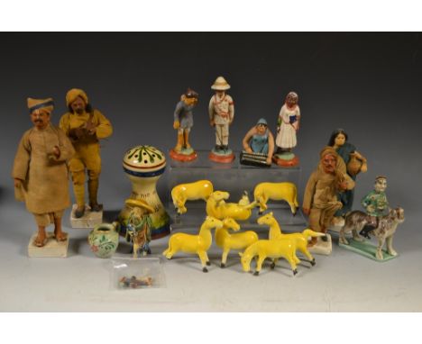 A set of Indian chalk figures, colonial and others; a set of seven Chinese horse models; a polychrome stoneware Persian style