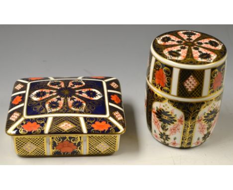 A Royal Crown Derby Imari 1128 pattern cylindrical jar and cover; a similar rounded rectangular trinket pot and cover (2)